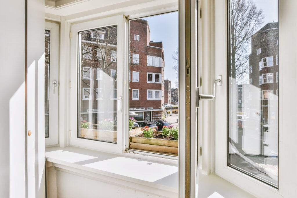 Vinyl window installed in a home, offering energy efficiency and easy maintenance.